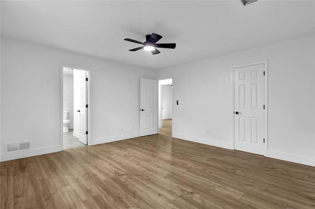 9148 Homewood Dr, Riverdale, GA 30274 - interior space featuring wood finished floors, baseboards, a ceiling fan, and visible vents