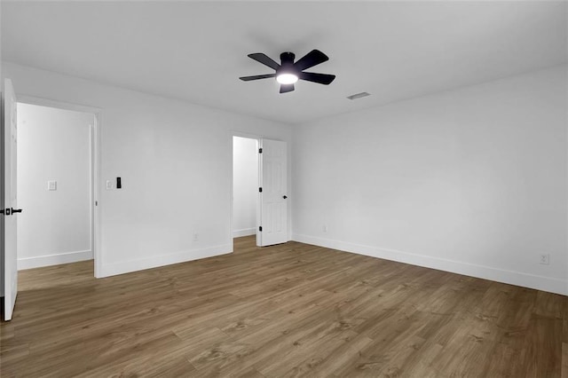 9148 Homewood Dr, Riverdale, GA 30274 - spare room featuring ceiling fan, baseboards, visible vents, and wood finished floors