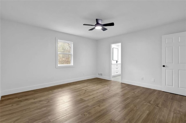 9148 Homewood Dr, Riverdale, GA 30274 - empty room featuring visible vents, baseboards, wood finished floors, and ceiling fan