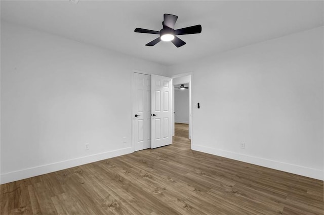9148 Homewood Dr, Riverdale, GA 30274 - unfurnished bedroom featuring baseboards, a ceiling fan, and wood finished floors