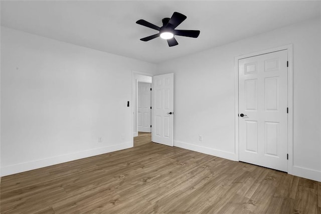 9148 Homewood Dr, Riverdale, GA 30274 - unfurnished bedroom featuring wood finished floors, ceiling fan, and baseboards
