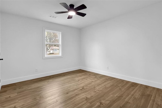 9148 Homewood Dr, Riverdale, GA 30274 - empty room with wood finished floors, baseboards, a ceiling fan, and visible vents