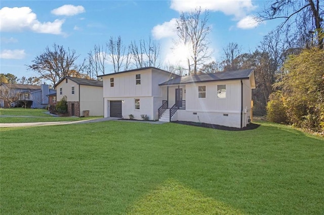 9148 Homewood Dr, Riverdale, GA 30274 - back of property with crawl space, a lawn, a garage, and aphalt driveway