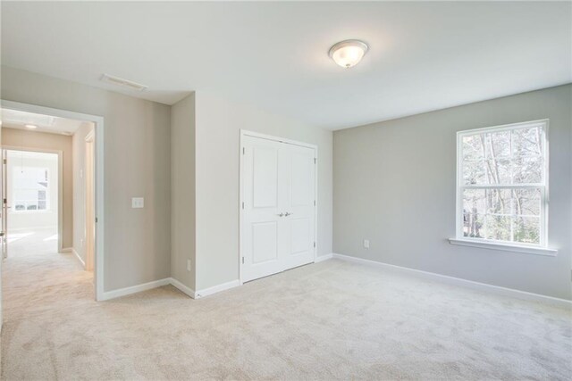 walk in closet with carpet flooring