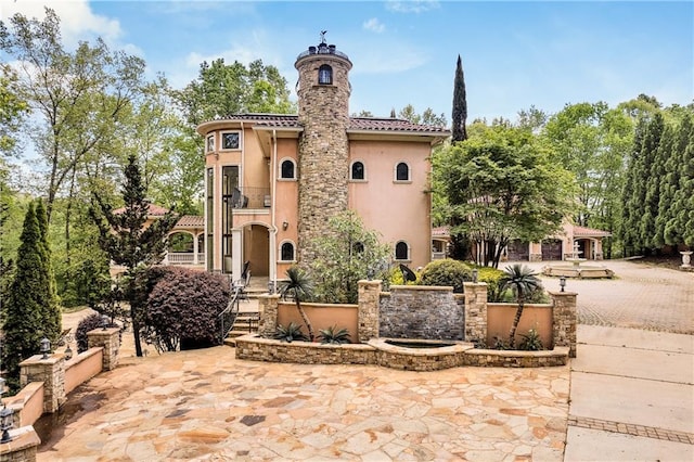 view of front facade with a patio area