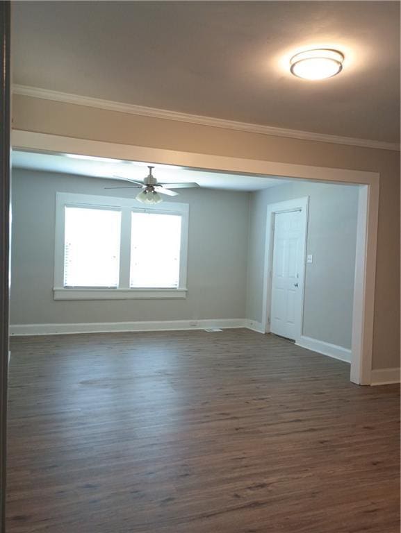 1131 Indale Pl SW, Atlanta, GA 30310 - spare room with baseboards, dark wood-type flooring, ceiling fan, and ornamental molding
