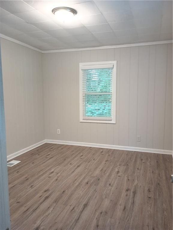 1131 Indale Pl SW, Atlanta, GA 30310 - unfurnished room featuring wood finished floors, crown molding, and baseboards