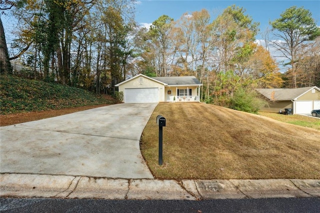 single story home with a porch and a garage