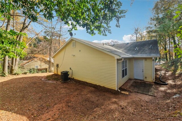 back of property with central AC unit