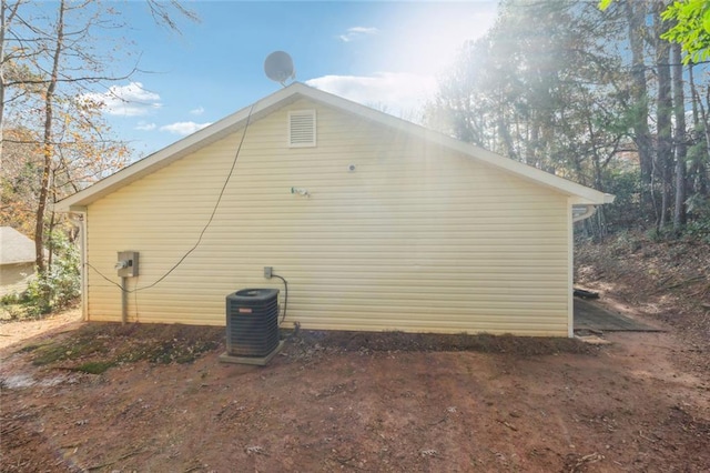 view of property exterior with central AC unit