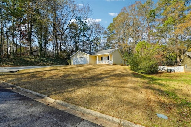 view of front of home with covered porch and a garage