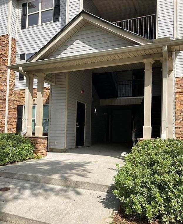 view of home's exterior with a carport