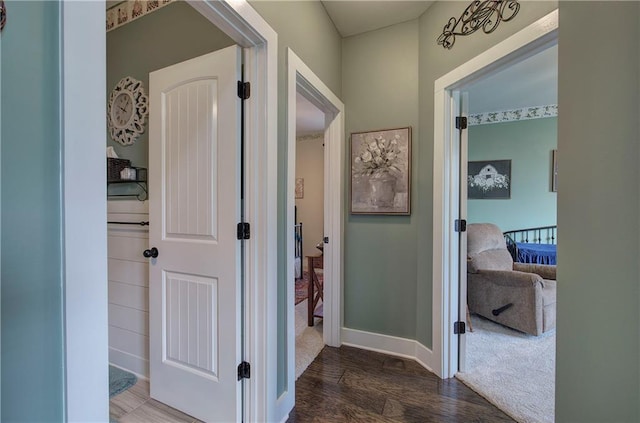 hall with dark hardwood / wood-style floors