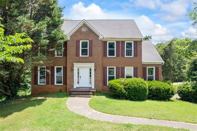 2196 Kildare Way NW, Kennesaw, GA 30152 - colonial inspired home featuring a front yard, brick siding, and roof with shingles