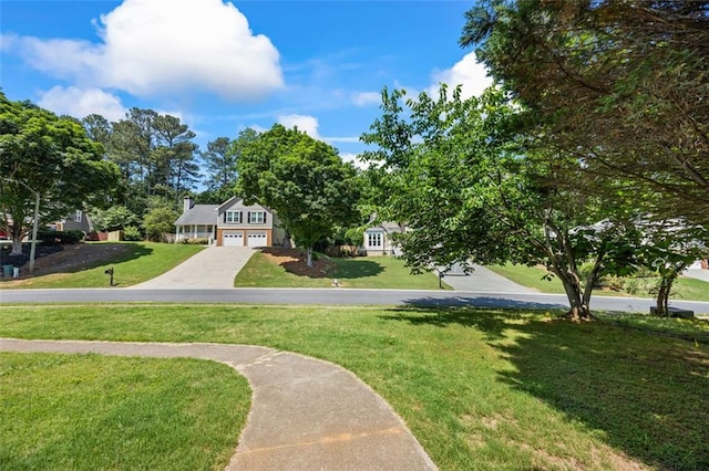 2196 Kildare Way NW, Kennesaw, GA 30152 - view of community featuring a yard, driveway, and a garage