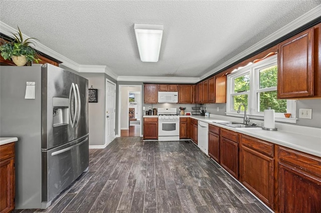 2196 Kildare Way NW, Kennesaw, GA 30152 - kitchen featuring white appliances, a sink, a textured ceiling, light countertops, and dark wood-style flooring