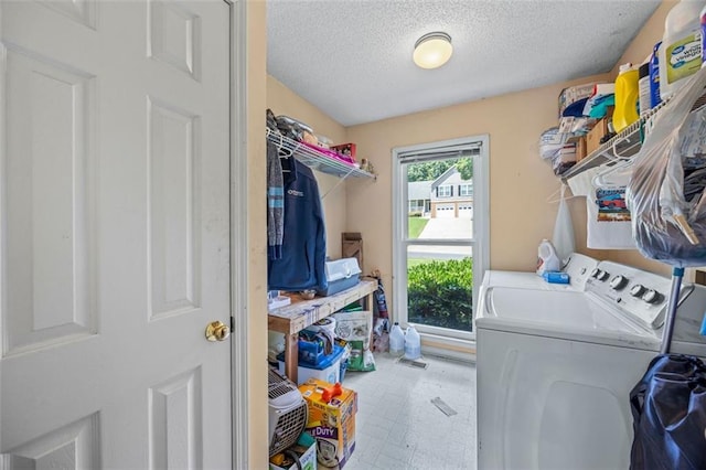 2196 Kildare Way NW, Kennesaw, GA 30152 - laundry room with washing machine and dryer, a textured ceiling, and tile patterned floors