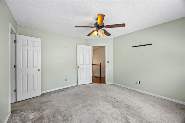 2196 Kildare Way NW, Kennesaw, GA 30152 - unfurnished bedroom featuring carpet, baseboards, a textured ceiling, and a ceiling fan