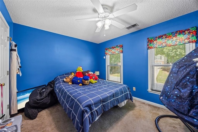 2196 Kildare Way NW, Kennesaw, GA 30152 - carpeted bedroom with a textured ceiling, ceiling fan, and baseboards