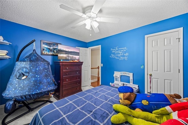 2196 Kildare Way NW, Kennesaw, GA 30152 - carpeted bedroom featuring a textured ceiling and ceiling fan