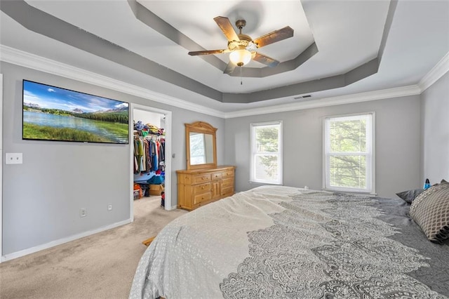 2196 Kildare Way NW, Kennesaw, GA 30152 - carpeted bedroom featuring a raised ceiling, baseboards, crown molding, a spacious closet, and a ceiling fan