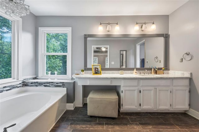 2196 Kildare Way NW, Kennesaw, GA 30152 - full bath featuring vanity, a garden tub, and wood tiled floors