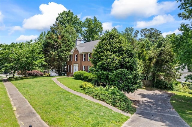 2196 Kildare Way NW, Kennesaw, GA 30152 - view of front of home with a front yard, a chimney, and driveway