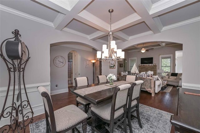295 Hanover Dr, Villa Rica, GA 30180 - dining space with arched walkways, ceiling fan, coffered ceiling, a chandelier, and dark wood-style floors