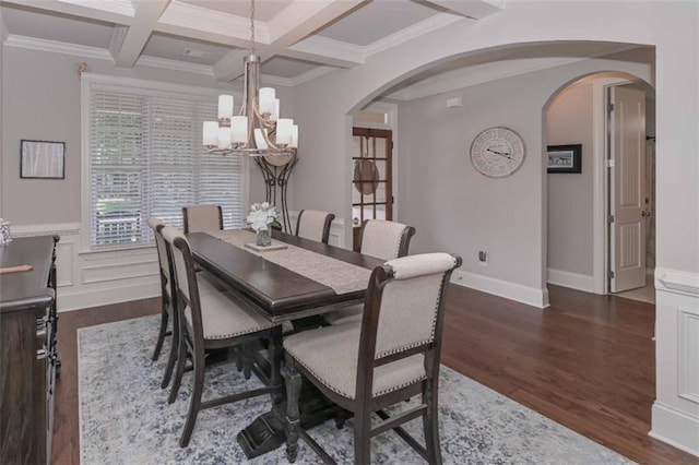 295 Hanover Dr, Villa Rica, GA 30180 - dining room with arched walkways, a chandelier, beamed ceiling, dark wood-style flooring, and coffered ceiling