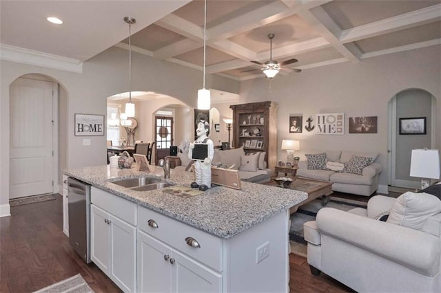 295 Hanover Dr, Villa Rica, GA 30180 - kitchen with arched walkways, open floor plan, dishwasher, a sink, and white cabinetry