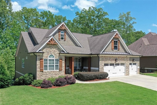 295 Hanover Dr, Villa Rica, GA 30180 - craftsman inspired home with stone siding, concrete driveway, an attached garage, a front yard, and roof with shingles