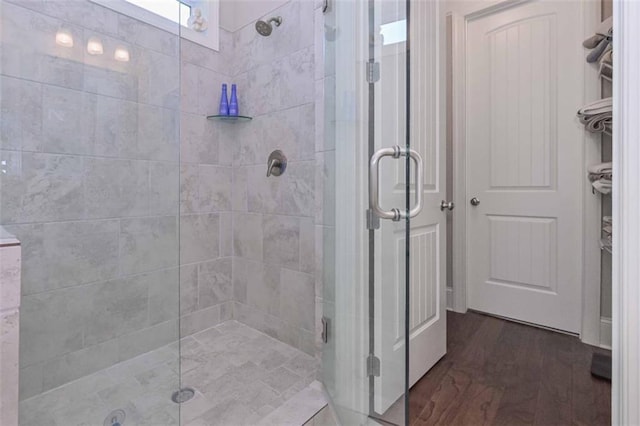 295 Hanover Dr, Villa Rica, GA 30180 - full bathroom with a shower stall and wood finished floors