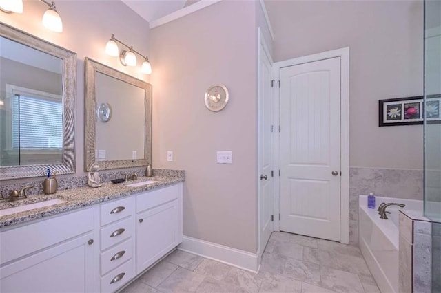 295 Hanover Dr, Villa Rica, GA 30180 - full bathroom featuring double vanity, a bath, and baseboards