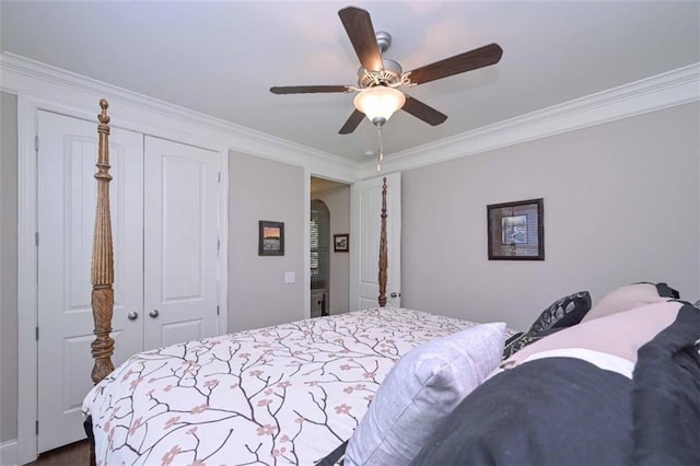 295 Hanover Dr, Villa Rica, GA 30180 - bedroom with ornamental molding, a closet, a ceiling fan, and arched walkways