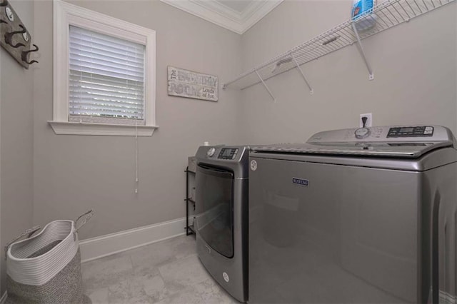 295 Hanover Dr, Villa Rica, GA 30180 - laundry room with washer and clothes dryer, crown molding, and baseboards