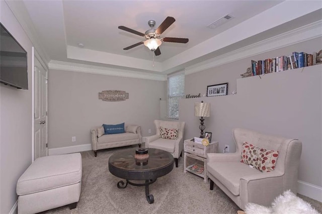 295 Hanover Dr, Villa Rica, GA 30180 - carpeted living room featuring ceiling fan, a raised ceiling, and baseboards