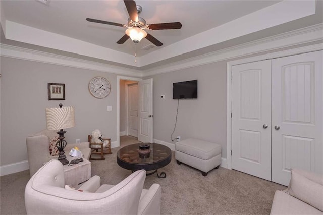 295 Hanover Dr, Villa Rica, GA 30180 - carpeted living area with a tray ceiling, baseboards, and a ceiling fan