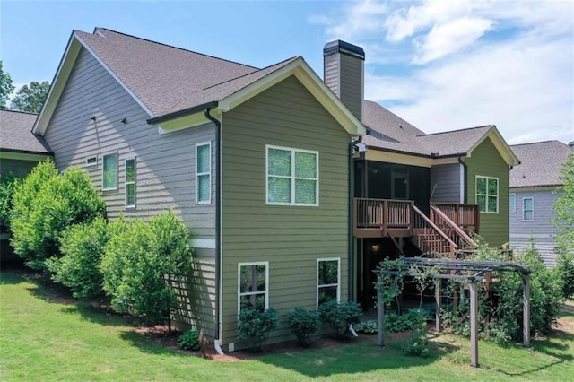 295 Hanover Dr, Villa Rica, GA 30180 - rear view of house featuring a chimney, stairway, and a lawn