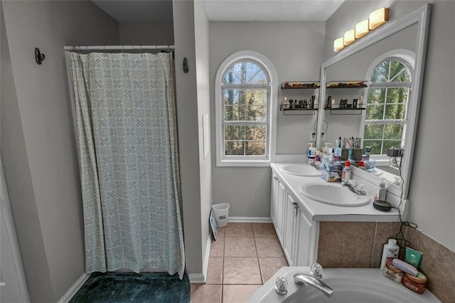 bathroom with tile patterned flooring, vanity, and independent shower and bath