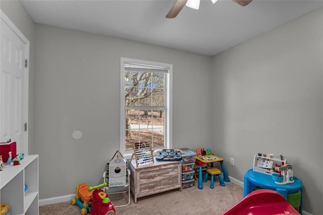 recreation room with ceiling fan and carpet floors