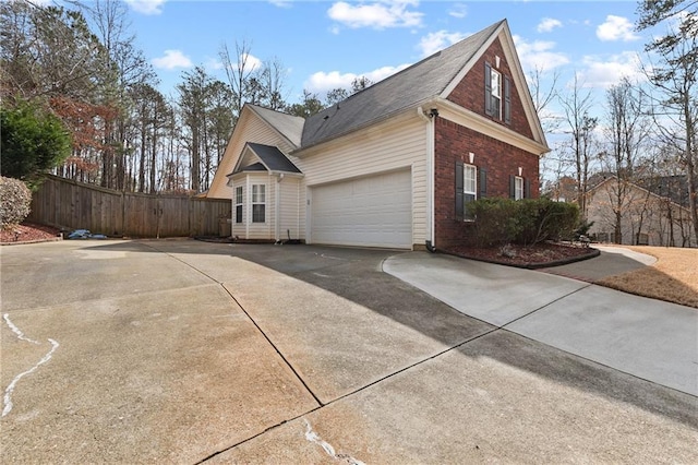 view of side of home featuring a garage