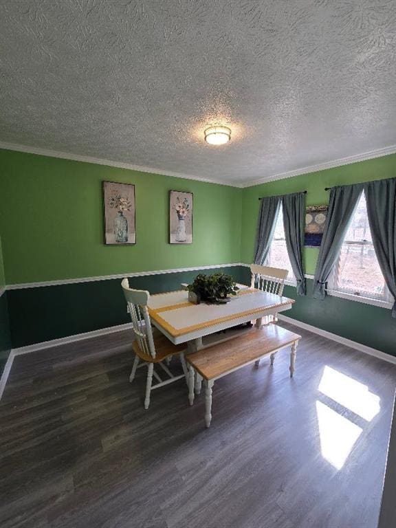 dining room with baseboards, breakfast area, and wood finished floors