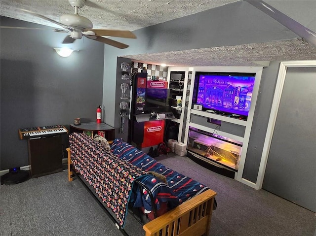 living room featuring carpet, ceiling fan, a textured ceiling, and baseboards