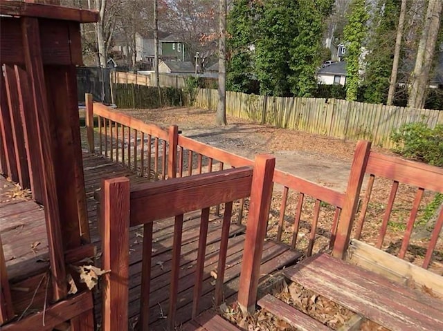 wooden deck featuring a fenced backyard