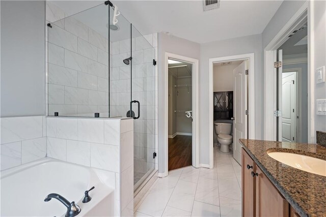 full bath with a stall shower, marble look tile flooring, a garden tub, vanity, and baseboards