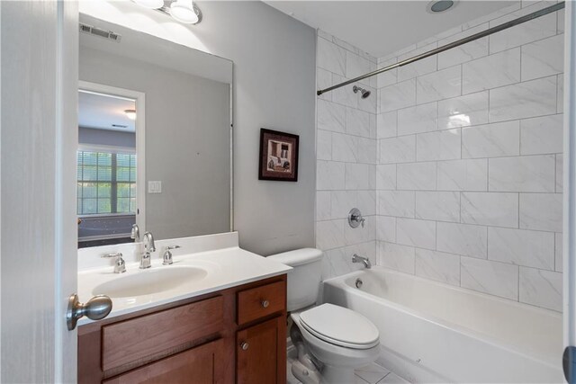 bathroom with toilet, tub / shower combination, and vanity