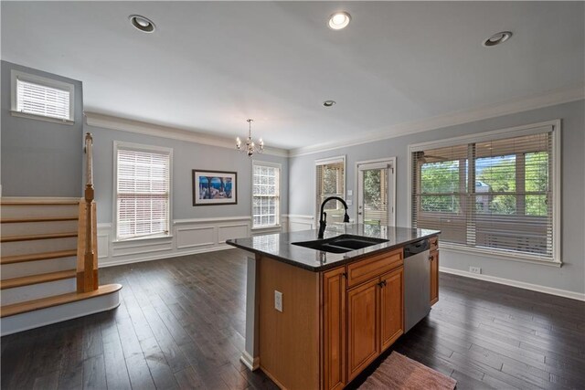 kitchen with a sink, dishwasher, brown cabinets, a chandelier, and ornamental molding