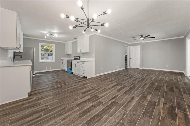 kitchen with ornamental molding, light countertops, stainless steel range with electric cooktop, and dark wood finished floors