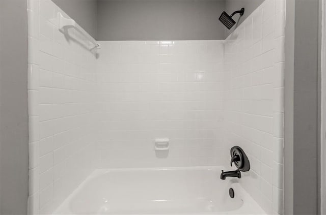 bathroom with bathing tub / shower combination