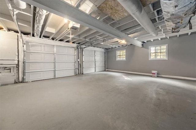 garage featuring baseboards and a garage door opener